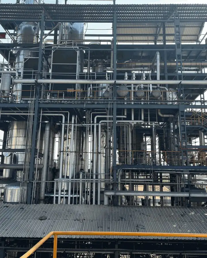 Distillation columns and process piping at a distillery plant