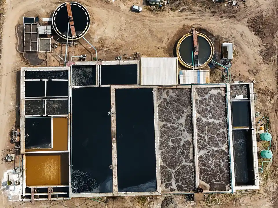 Top-down aerial view of the SBS Water treatment plant at Balaji Sugar, with clarifiers, aeration basins and process tanks
