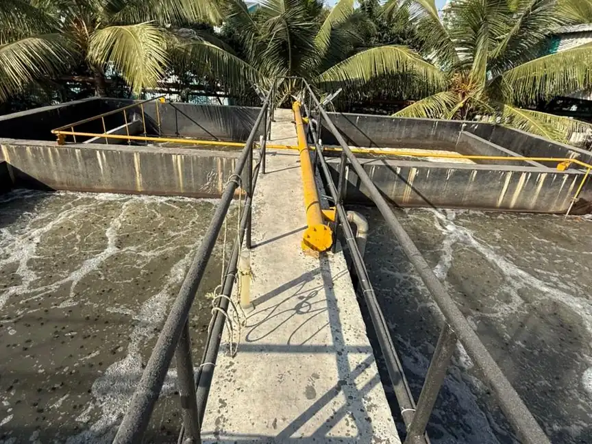 Walkway between aerated treatment tanks at the SBS Water plant at Ambalika Sugars