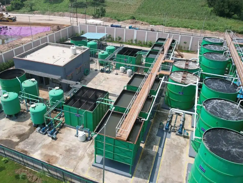Aerial view of a sewage treatment plant built by SBS Water with green process tanks